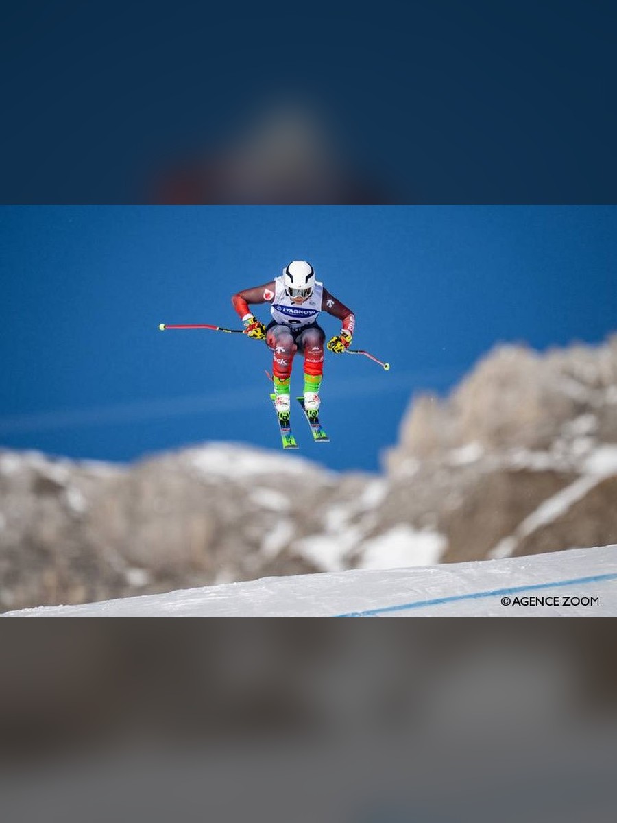 Abby McEwen airborne during a ski cross race